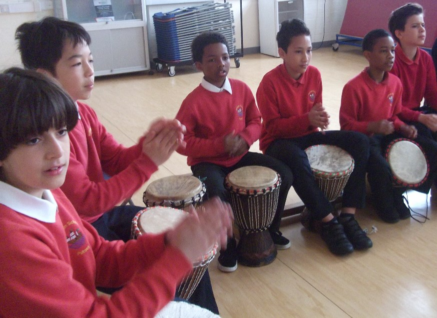 School Children with African Drums learning drumming
